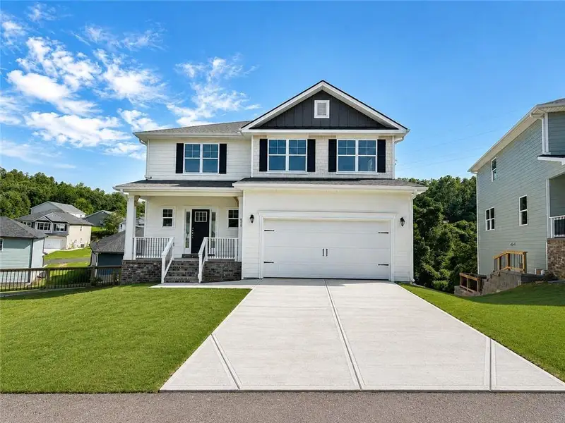 Front exterior of a new home in Habersham Meadows, Demorest, GA, highlighting curb appeal (Image 1). Front exterior of a new home in Habersham Meadows, Demorest, GA, highlighting curb appeal (Image 1).