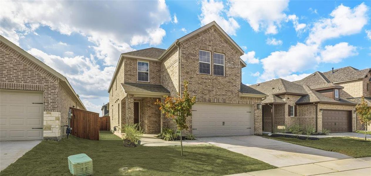 Front exterior of a new home in Walden Pond, Forney, TX, highlighting curb appeal (Image 2). Front exterior of a new home in Walden Pond, Forney, TX, highlighting curb appeal (Image 2).