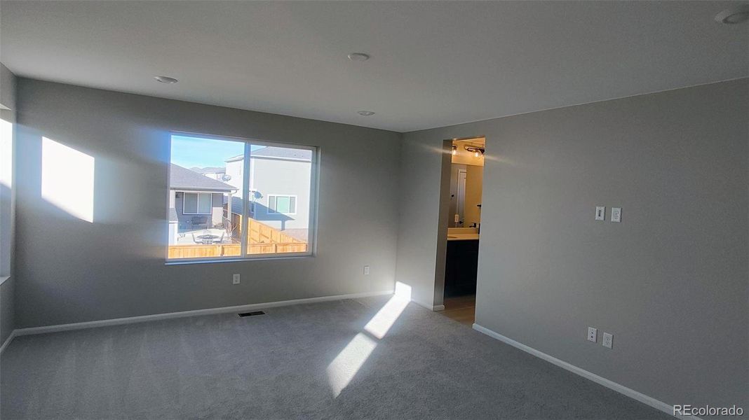 Spacious, unfurnished interior of a new home in The Cottages Collection at Ridgeline Vista, Brighton (Image 7).