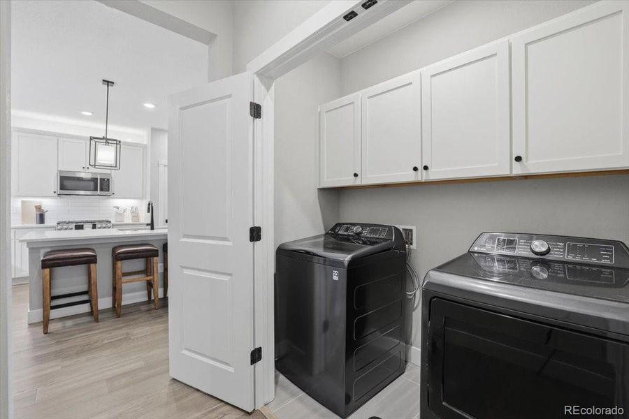 The laundry is conveniently located on the mail floor off the kitchen and near the primary bedroom.