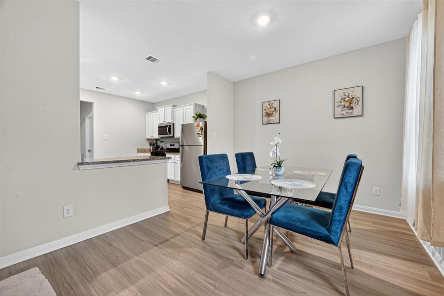Alternate view of the dining room looking onto the kitchen. Alternate view of the dining room looking onto the kitchen.