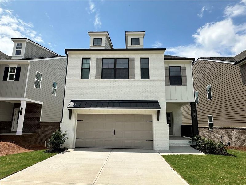 Front exterior of a new home in Kentmere, Auburn, GA, highlighting curb appeal (Image 2). Front exterior of a new home in Kentmere, Auburn, GA, highlighting curb appeal (Image 2).