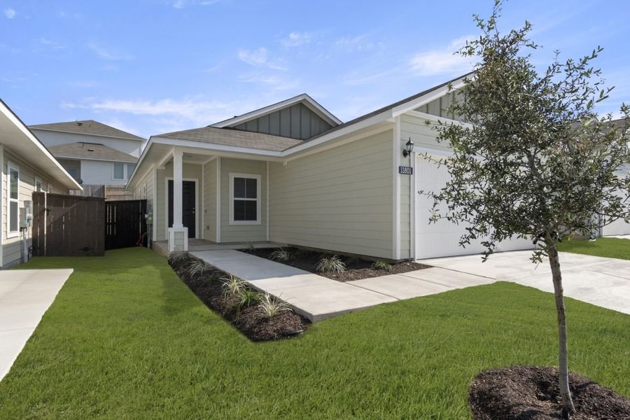Front exterior of a new home in Cloverleaf, Austin, TX, highlighting curb appeal (Image 2). Front exterior of a new home in Cloverleaf, Austin, TX, highlighting curb appeal (Image 2).