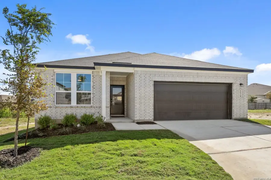 Front exterior of a new home in Comanche Ridge, San Antonio, TX, highlighting curb appeal (Image 2). Front exterior of a new home in Comanche Ridge, San Antonio, TX, highlighting curb appeal (Image 2).