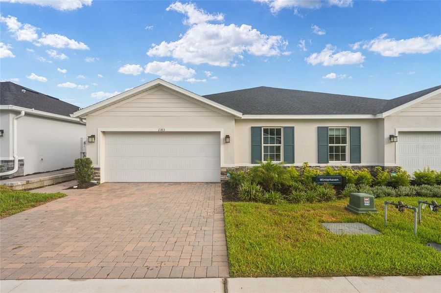 Front exterior of a new home in , Lady Lake, FL, highlighting curb appeal (Image 2). Front exterior of a new home in , Lady Lake, FL, highlighting curb appeal (Image 2).