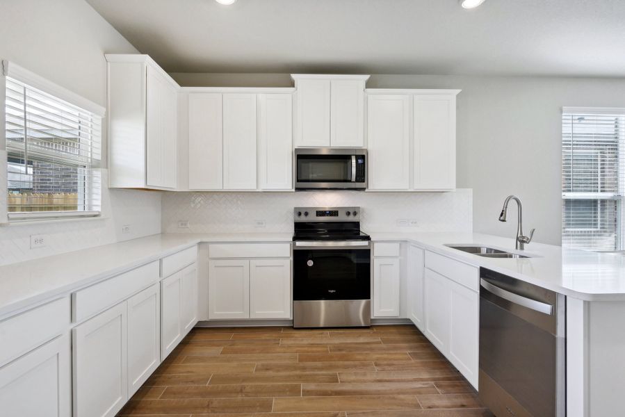 Kitchen in the Medina floorplan at a Meritage Homes community.