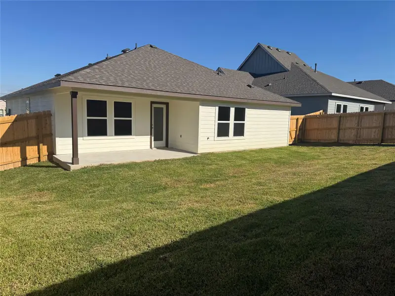 Exterior details and patio area of a home in Liberty Village, Brenham (Image 1).