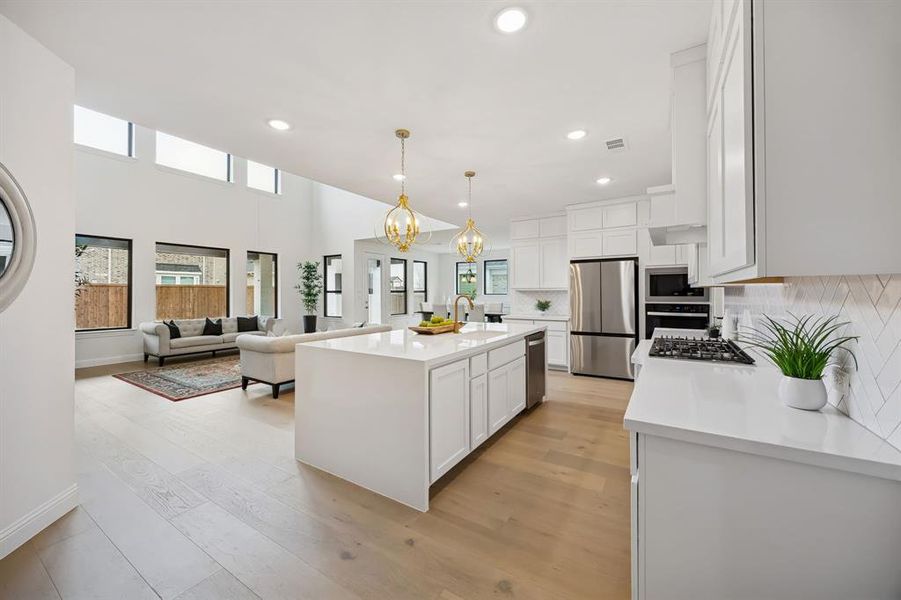 Robbins Coastside nine-inch engineered hardwood extends seamlessly across both floors with no carpet anywhere. Robbins Coastside nine-inch engineered hardwood extends seamlessly across both floors with no carpet anywhere.