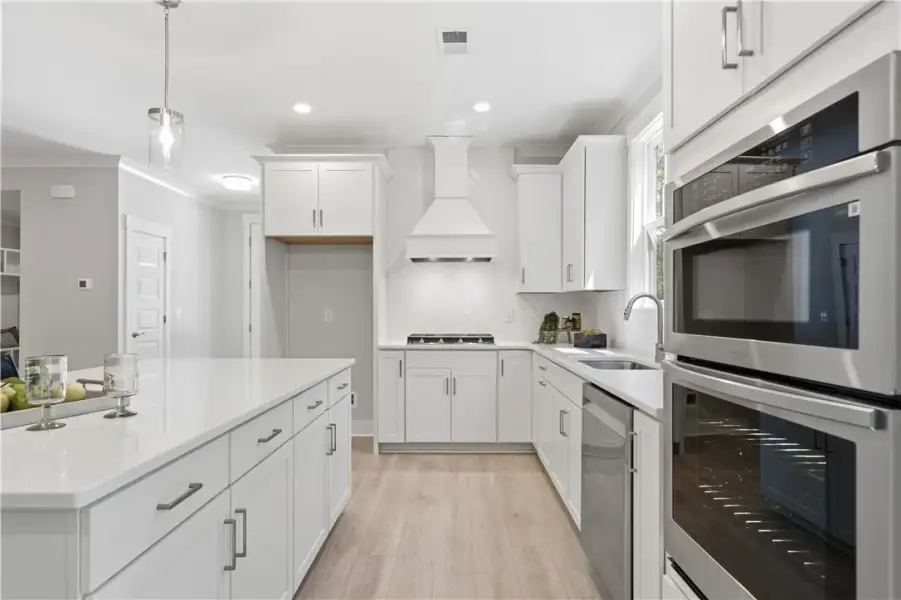 Gleaming stone countertops and modern stainless st