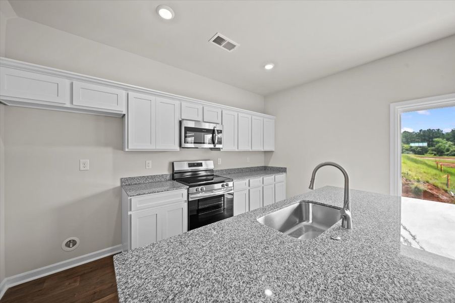 Representative furnished interior of a home built from the Palmetto II by McGuinn Homes in Clarke Townes, Anderson (Image 52).