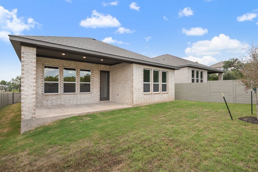 Exterior details and patio area of a home in Arbor Collection At Wolf Ranch, Georgetown (Image 24).