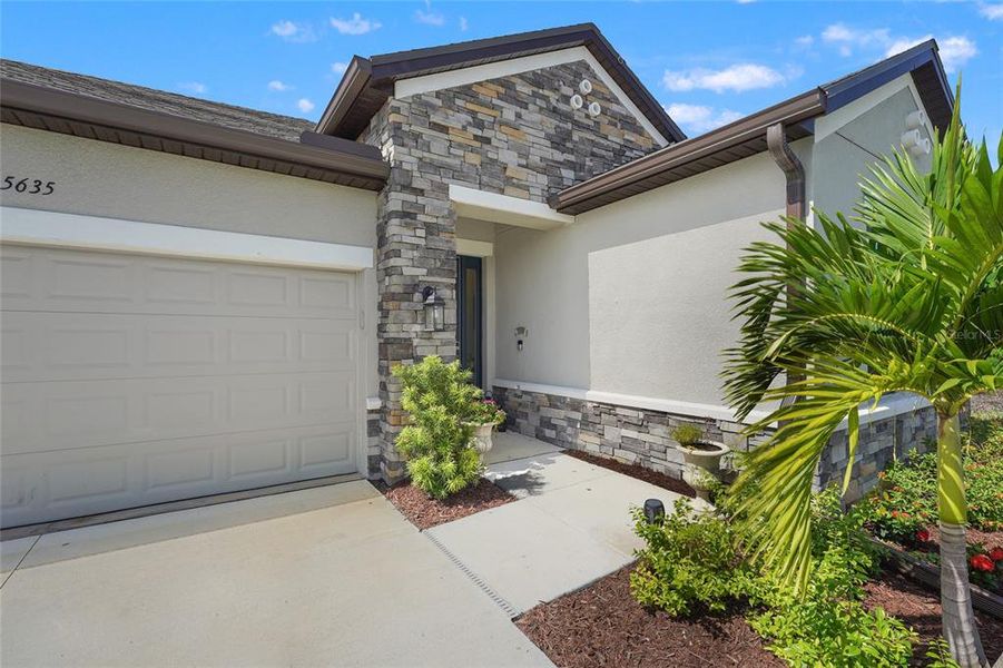 Front exterior of a new home in , Nokomis, FL, highlighting curb appeal (Image 27). Front exterior of a new home in , Nokomis, FL, highlighting curb appeal (Image 27).