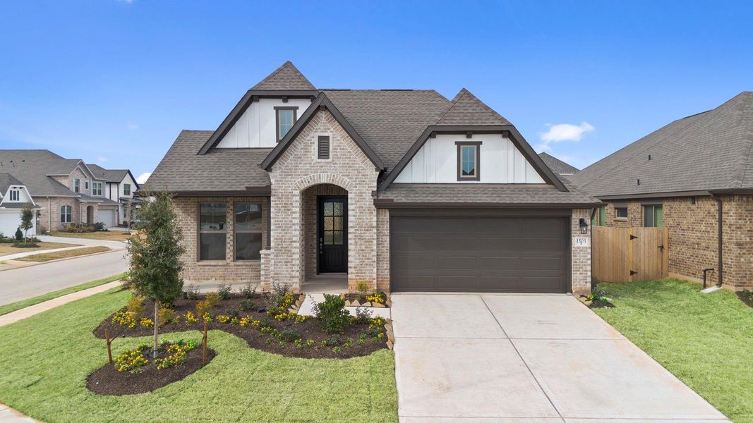 Front exterior of a new home in Escondido, Magnolia, TX, highlighting curb appeal (Image 21).