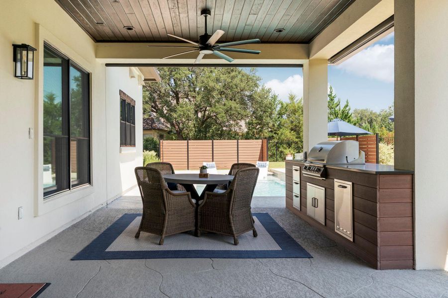 Covered patio featuring beautiful wood ceiling, built-in BBQ grill with storage. Remote controlled power sun screens make this space amazing for sheltering heat and entertaining. Covered patio featuring beautiful wood ceiling, built-in BBQ grill with storage. Remote controlled power sun screens make this space amazing for sheltering heat and entertaining.