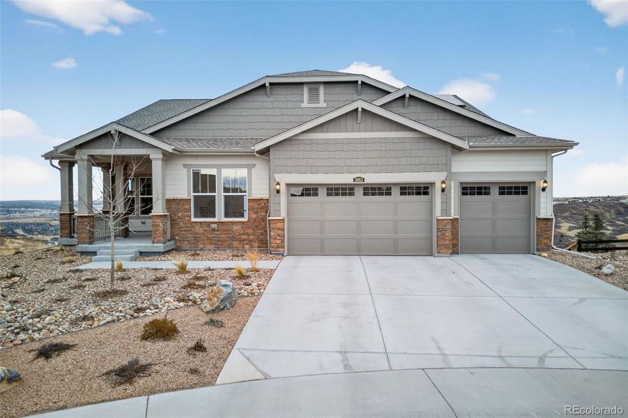 Front exterior of a new home in Macanta: The Legends Collection, Castle Rock, CO, highlighting curb appeal (Image 2). Front exterior of a new home in Macanta: The Legends Collection, Castle Rock, CO, highlighting curb appeal (Image 2).