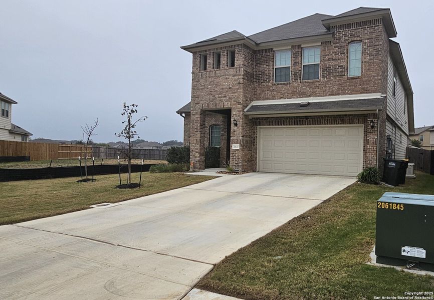 Front exterior of a new home in Rhine Valley, Schertz, TX, highlighting curb appeal (Image 22).
