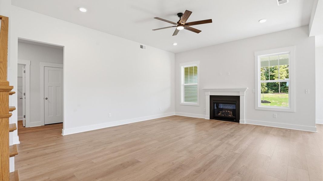 Memorable moments begin in this elegant, open family room with hardwood flooring and refined finishes Memorable moments begin in this elegant, open family room with hardwood flooring and refined finishes