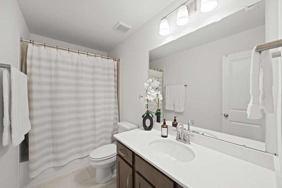 A second, upstairs full-bath is located between two of the upstairs bedrooms.