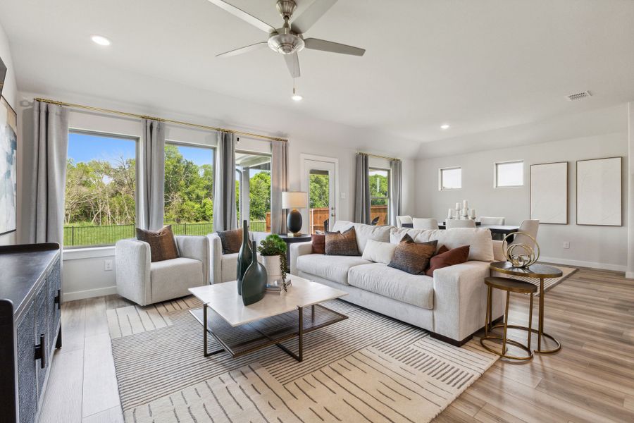 Living Room in the Emmy II home plan by Trophy Signature Homes - REPRESENTATIVE PHOTO