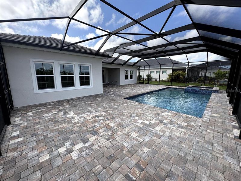 Exterior details and patio area of a home in EVERLY at Wellen Park, Venice (Image 26).