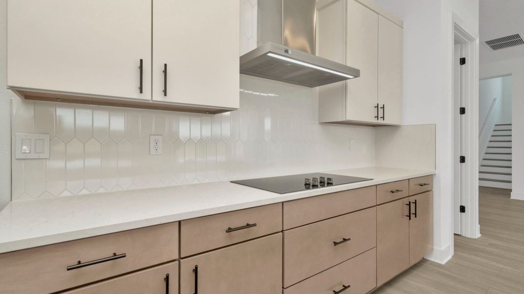 The Kitchen of a DRB Homes Grand Hawk which is offered as a home plan at Serengeti in Spring Hill, FL.