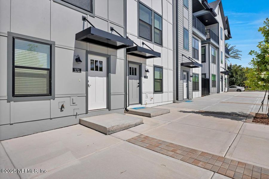 Front exterior of a new home in Johnson Commons, Jacksonville, FL, highlighting curb appeal (Image 1). Front exterior of a new home in Johnson Commons, Jacksonville, FL, highlighting curb appeal (Image 1).