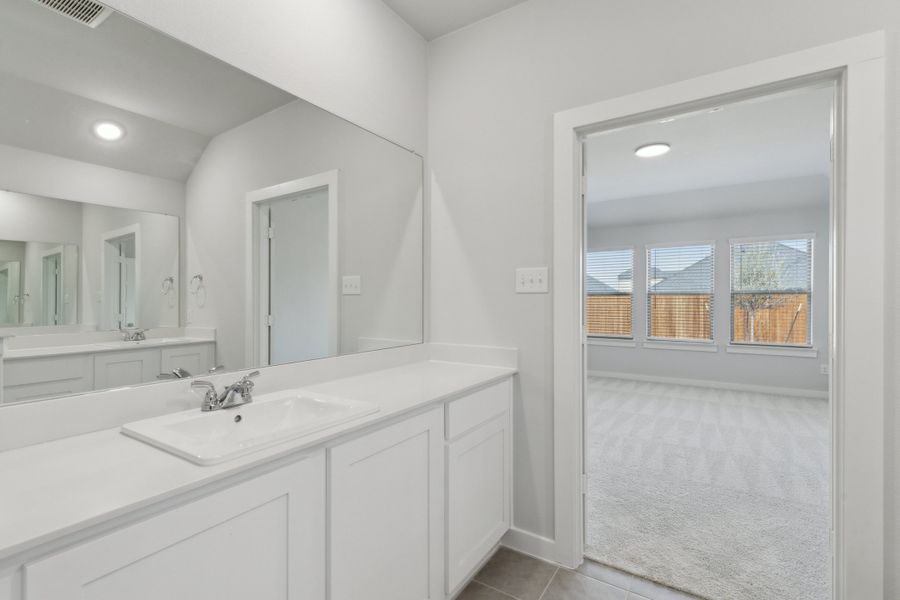 Primary Bathroom in the Harrison home plan by Trophy Signature Homes – REPRESENTATIVE PHOTO