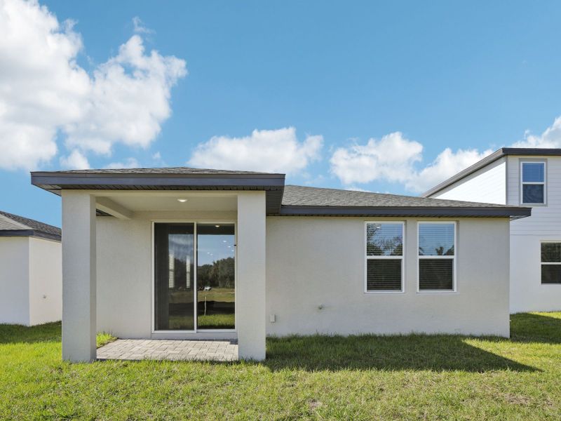 Exterior details and patio area of a home in The Reserve at Hammock Oaks - Classic Series, Lady Lake (Image 2).