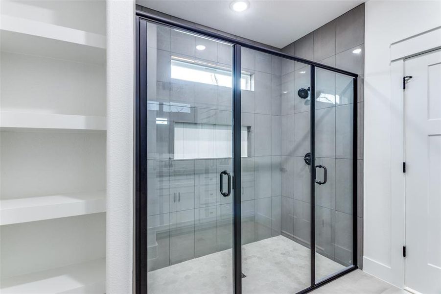 Bathroom featuring a stall shower and recessed lighting