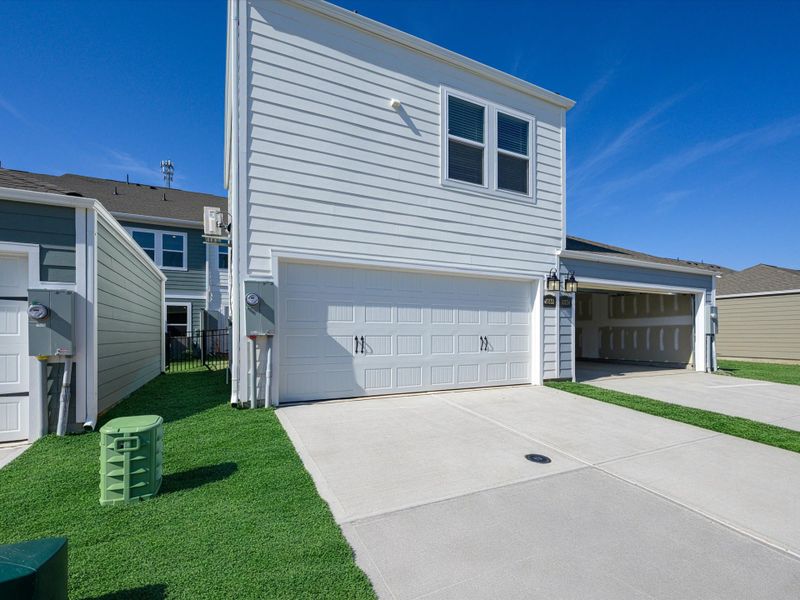 Exterior details and patio area of a home in North Creek Village - Townhomes, Huntersville (Image 4).