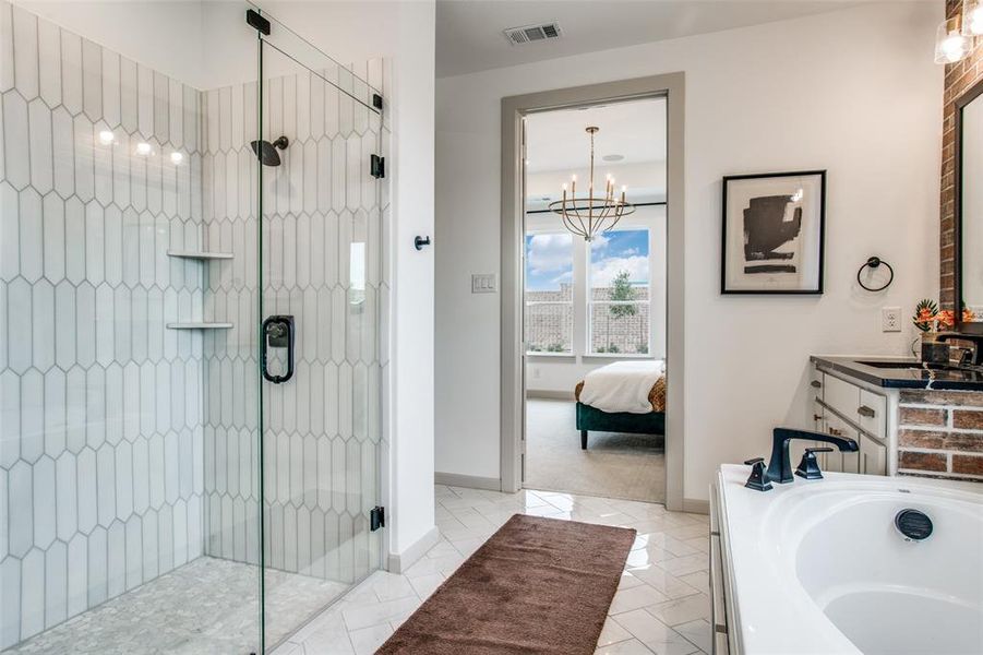 Your new owner's bath features a lovely garden tub paired with a spacious walk in shower.