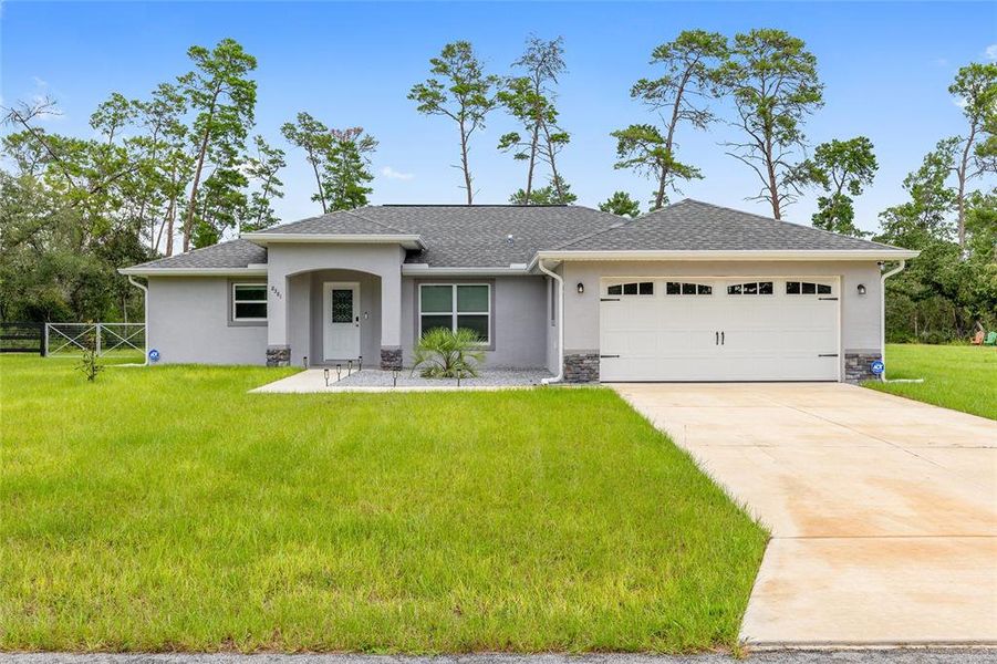 Front exterior of a new home in , Dunnellon, FL, highlighting curb appeal (Image 20).