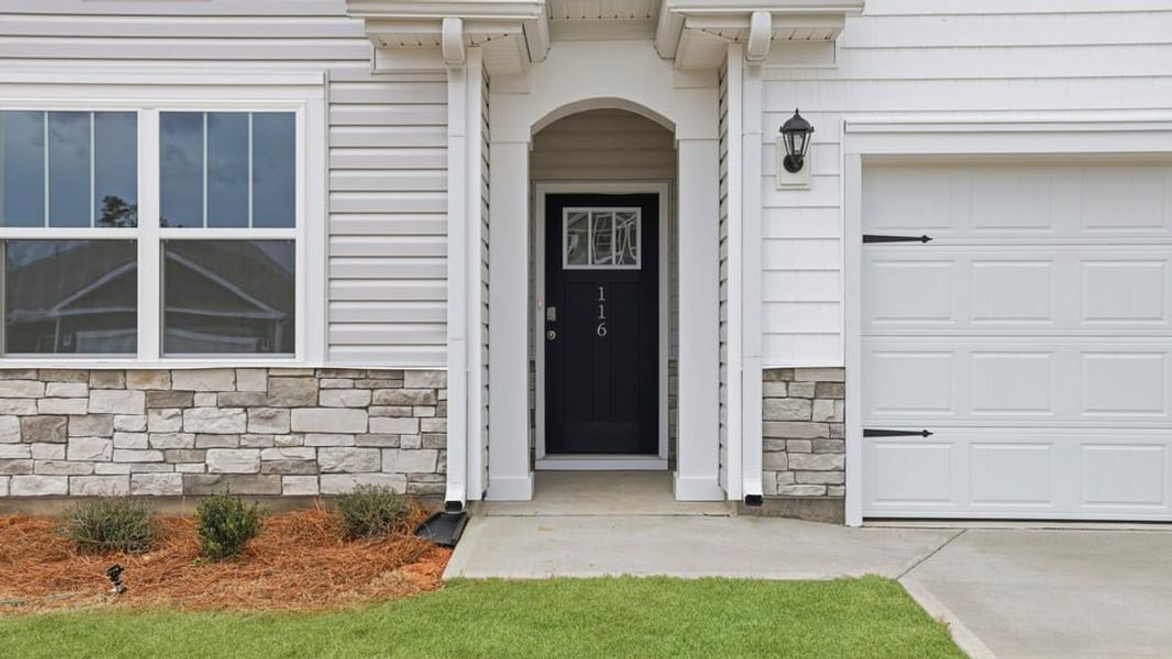 Exterior details and patio area of a home in Durbin Meadows Traditions, Fountain Inn (Image 2). Exterior details and patio area of a home in Durbin Meadows Traditions, Fountain Inn (Image 2).