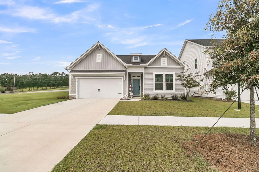 Front exterior of a new home in The Groves of Berkeley, Moncks Corner, SC, highlighting curb appeal (Image 23).