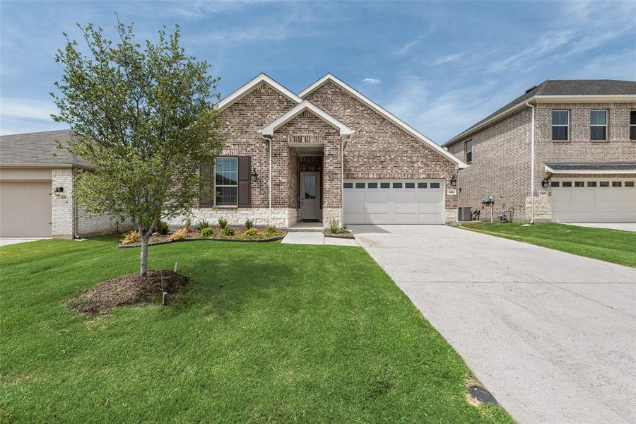 Front exterior of a new home in Villages of Hurricane Creek, Anna, TX, highlighting curb appeal (Image 20). Front exterior of a new home in Villages of Hurricane Creek, Anna, TX, highlighting curb appeal (Image 20).