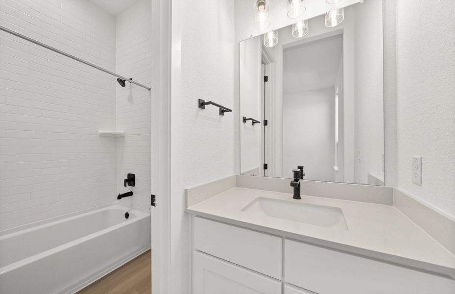 Furnished interior view inside a new home in 6 Creeks, Kyle (Image 7).