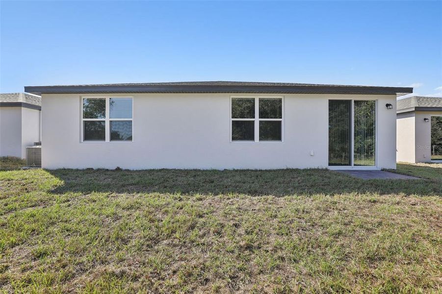 Exterior details and patio area of a home in Bradbury Creek - Signature Series, Haines City (Image 3).
