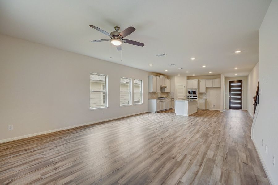 Living room, dining room, and kitchen in the Pearl floorplan at a Meritage Homes community.