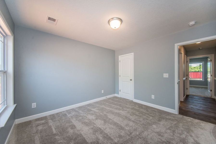 Representative unfurnished interior of a home built from the Jackson by Enchanted Homes in Lonesome Dove, San Antonio (Image 44).