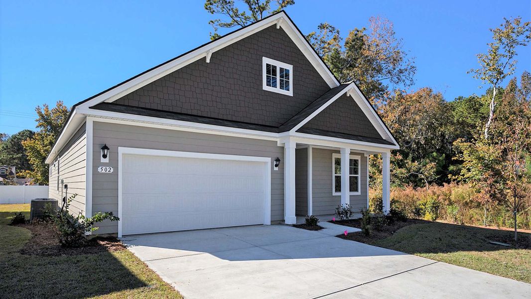 Front exterior of a new home in Haven View, Murrells Inlet, SC, highlighting curb appeal (Image 2).