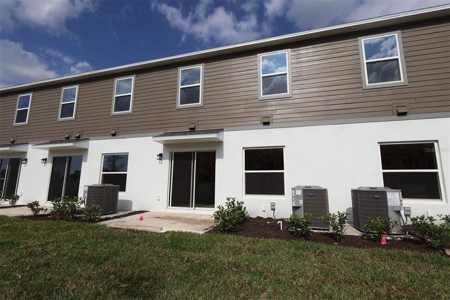 Front exterior of a new home in Tyson Ranch, Orlando, FL, highlighting curb appeal (Image 16). Front exterior of a new home in Tyson Ranch, Orlando, FL, highlighting curb appeal (Image 16).