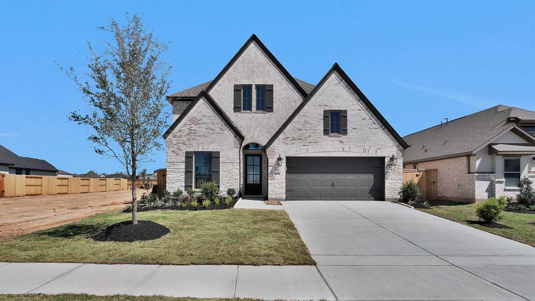 Front exterior of a new home in Candela, Richmond, TX, highlighting curb appeal (Image 1). Front exterior of a new home in Candela, Richmond, TX, highlighting curb appeal (Image 1).