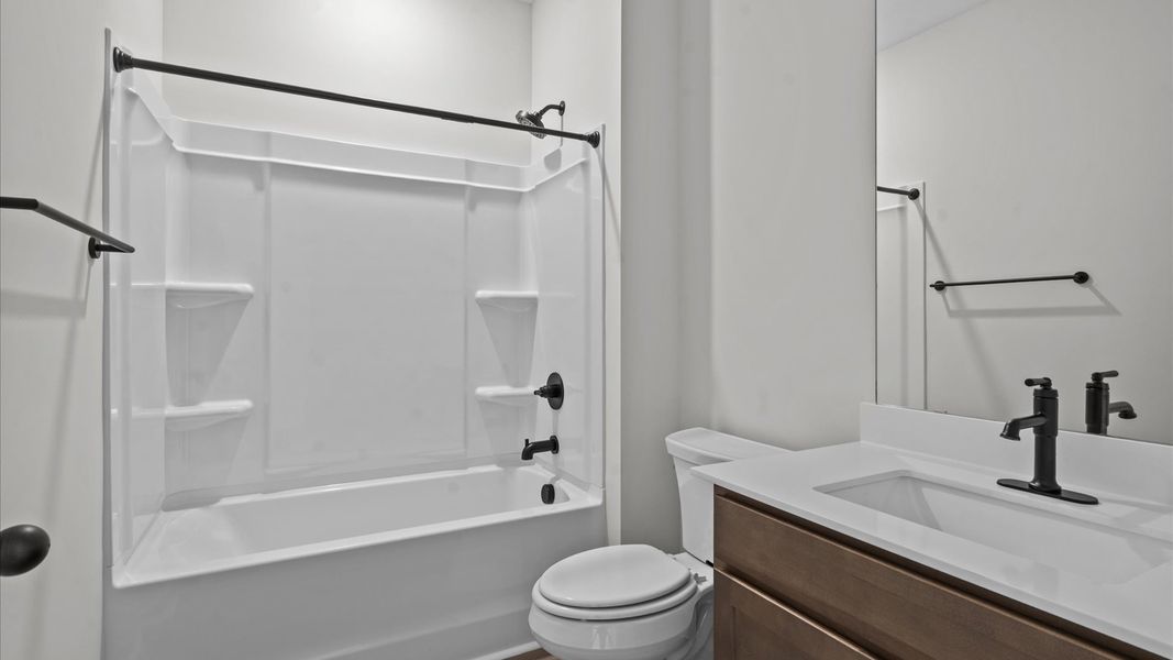 Top-notch bathroom with current fixtures, tasteful materials, and elevated charm Top-notch bathroom with current fixtures, tasteful materials, and elevated charm