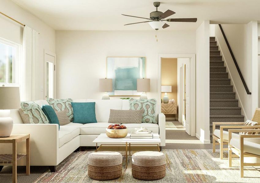 Rendering of the family room featuring living room furniture and lots of natural light flooding in from the windows. Rendering of the family room featuring living room furniture and lots of natural light flooding in from the windows.