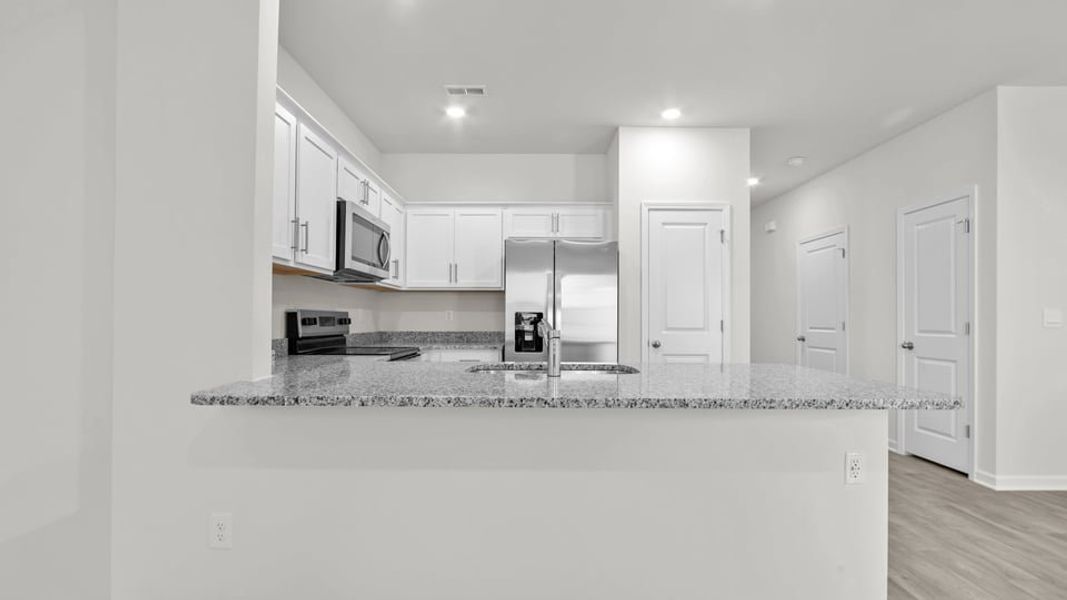 Furnished interior view inside a new home in The Townes at Ridgewood Farms, Winterville (Image 3).