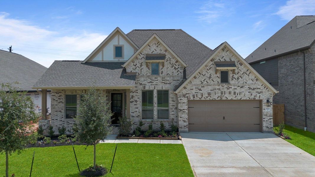 Front exterior of a new home in Coastal Point, League City, TX, highlighting curb appeal (Image 23).
