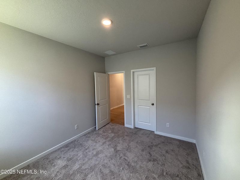 Spacious, unfurnished interior of a new home in The Magnolia Series at Reserve East, Flagler Beach (Image 24).