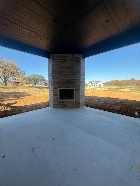 Stone fireplace to complete the outdoor living space.