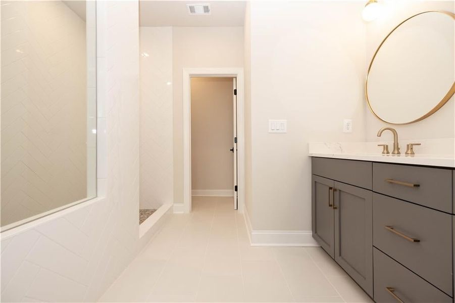 Owner's bath showcasing our Walk in oversized shower with Drying area