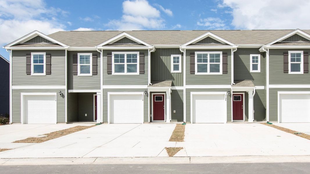 Front exterior of a home in the The Cove at Glenns Bay community, located in Surfside Beach, SC (Image 8).